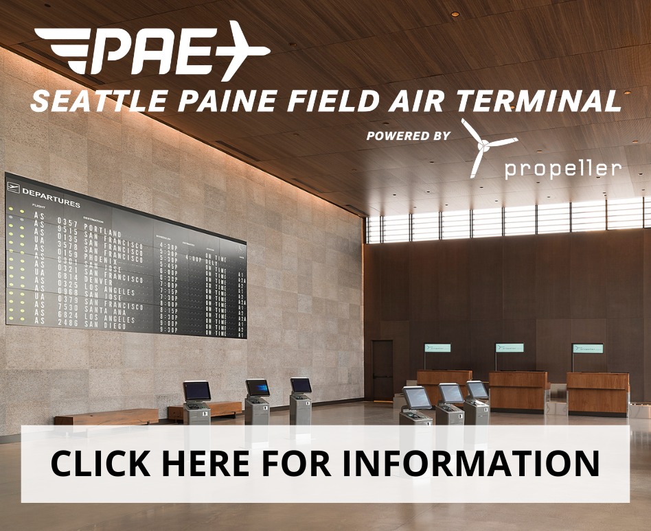Seattle Paine Field terminal with contemporary architecture, highlighting its entrance and flight status board