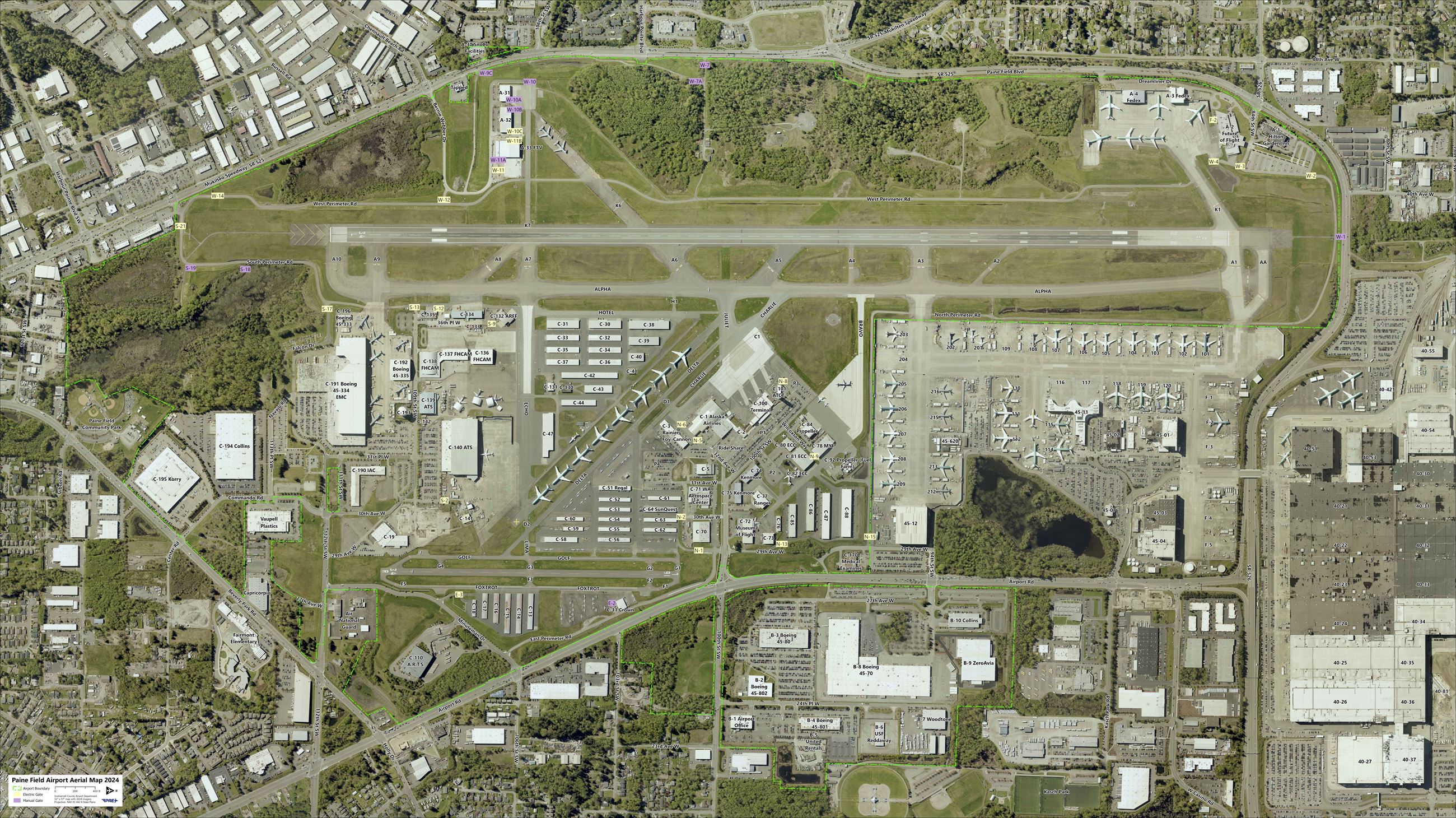 Aerial image of Paine Field in horizontal layout with green line showing airport property border … Opens in new window